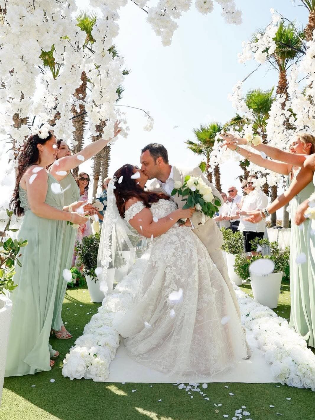 Couple in formal wedding wear confetti shot
